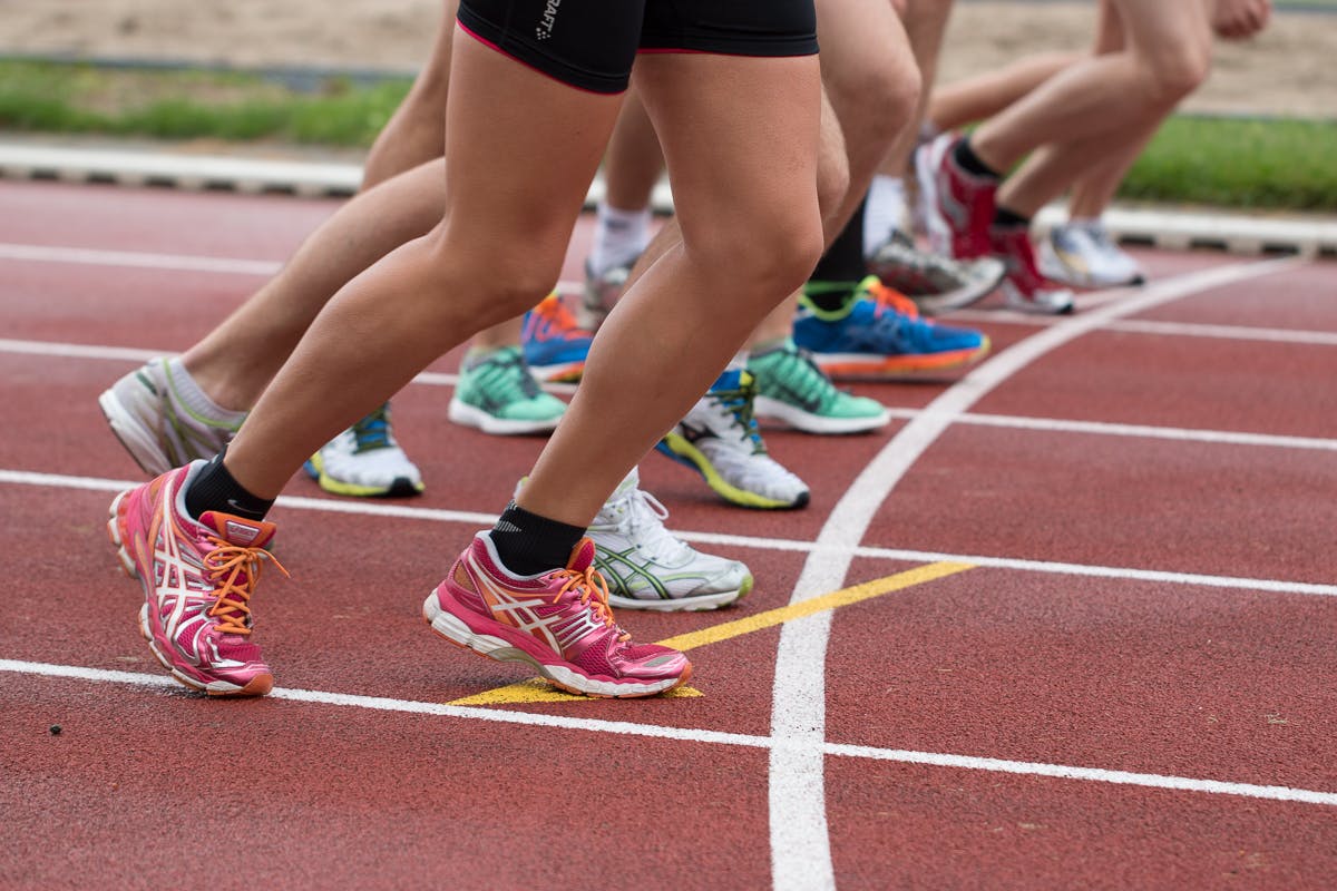 Marathon runners racing through city streets