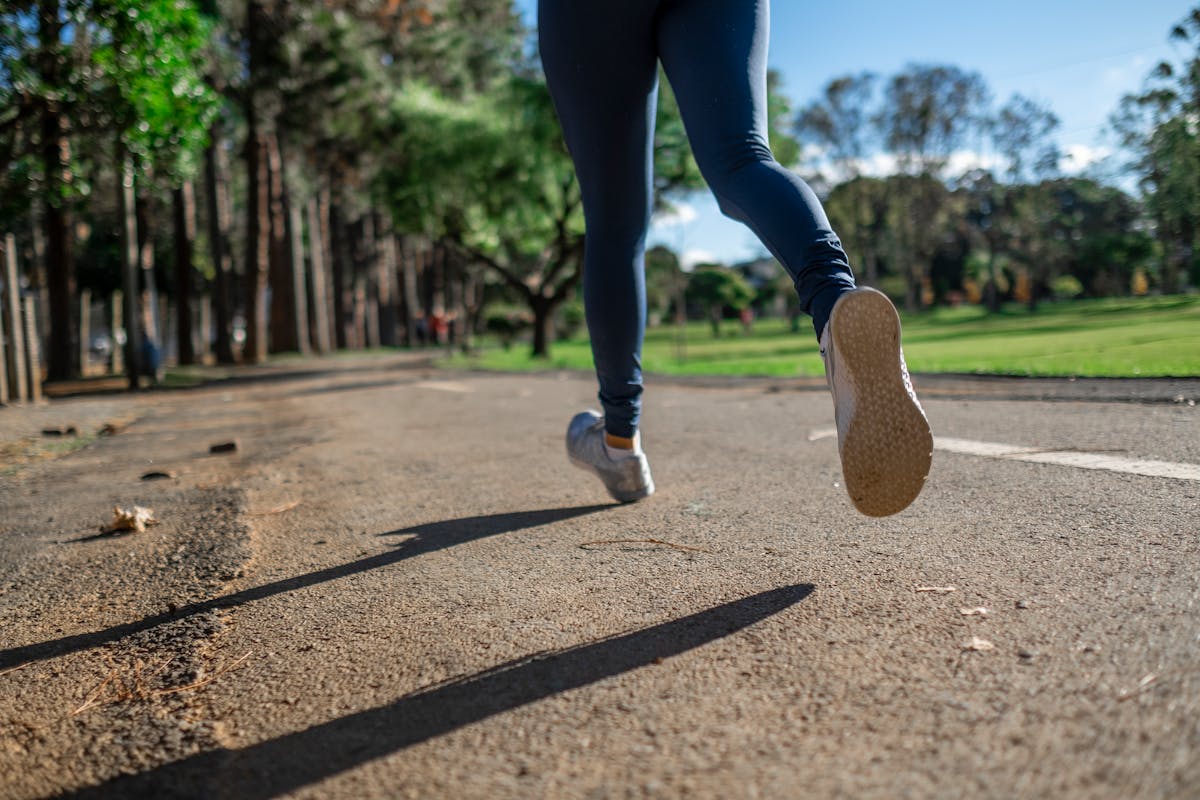 Person jogging in a park as a beginner runner