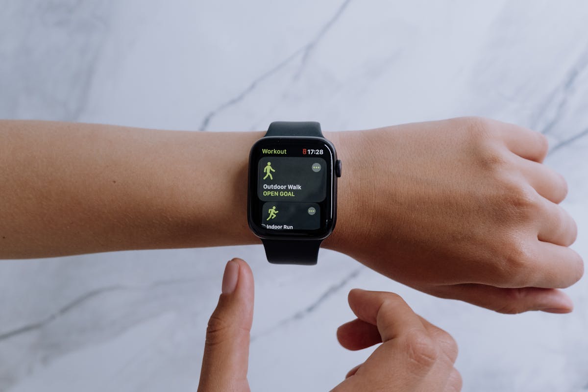 Runner with a smartwatch connected to Strava